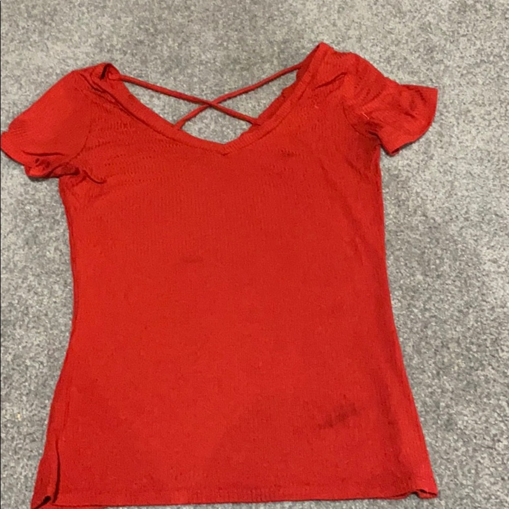 Red v neck with a cross in the back